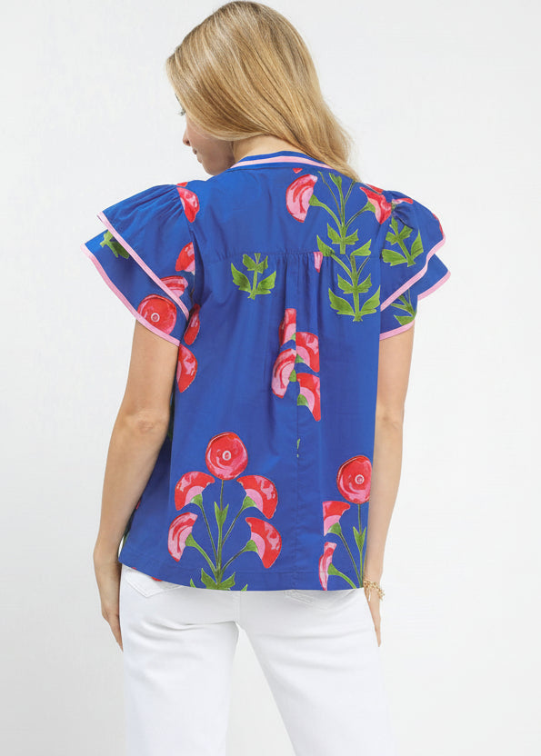 Woman wearing a blue floral blouse on a white background