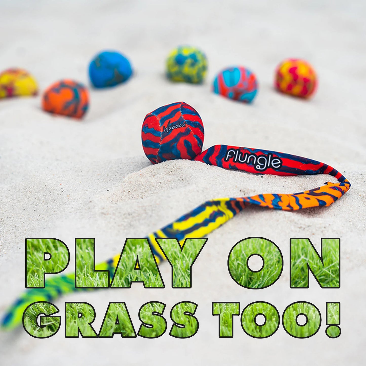Colorful dog toy with 'Flungle' branding on a sandy background with text 'Play on Grass Too!'.
