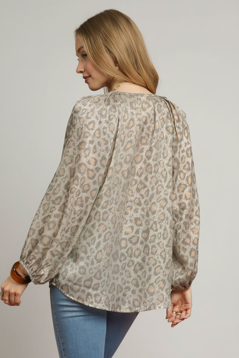 Woman wearing a leopard print blouse