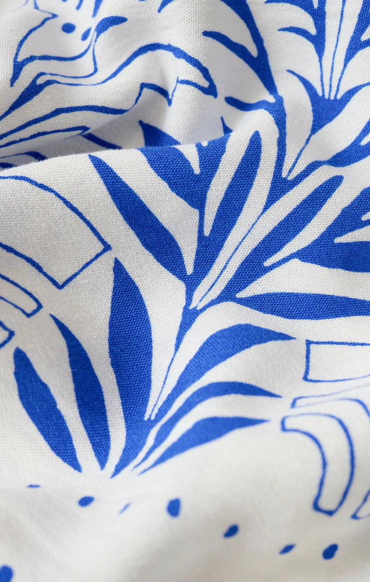 Close-up of blue leaf pattern on white fabric