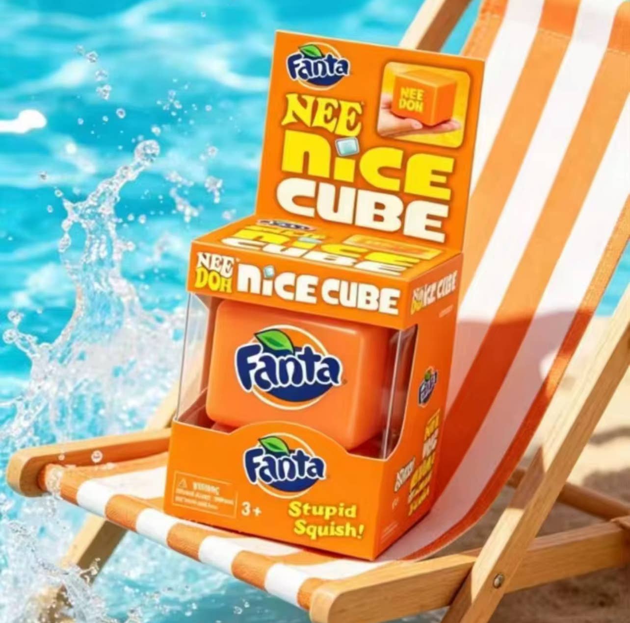Fanta Nee Nice Cube packaging on a beach chair with water in the background