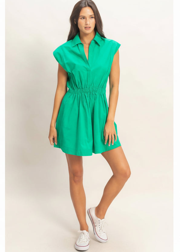 Woman wearing a green dress on a white background