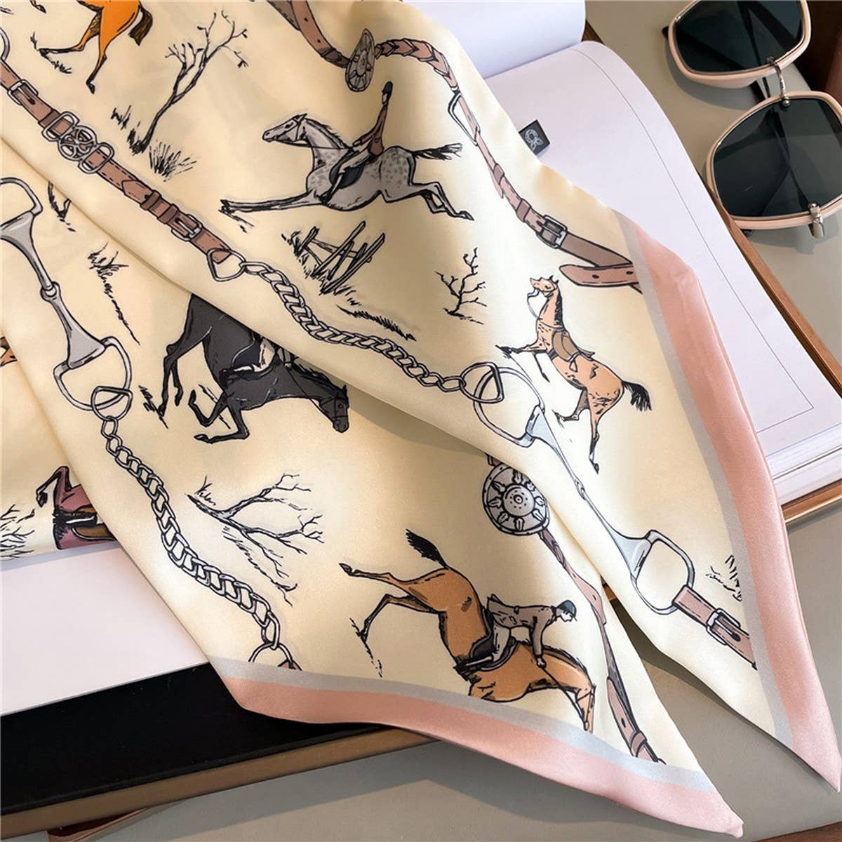 Scarf with horse and equestrian pattern on a surface