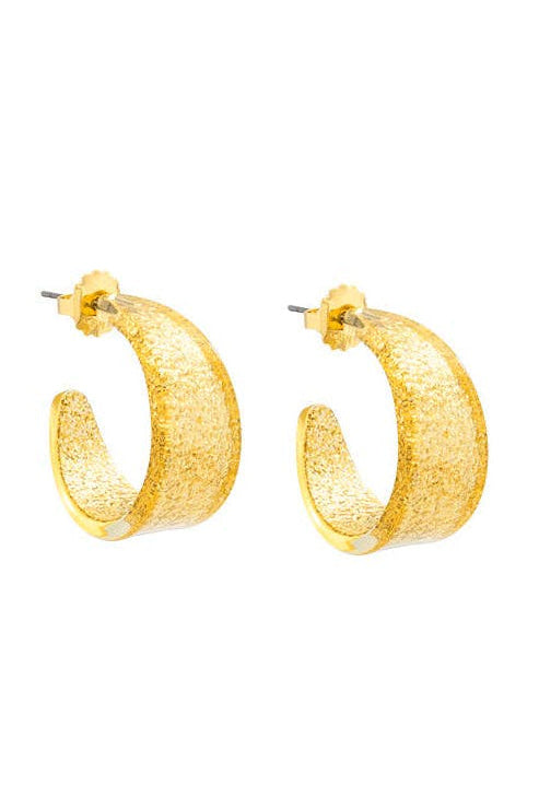 Gold hoop earrings on a white background