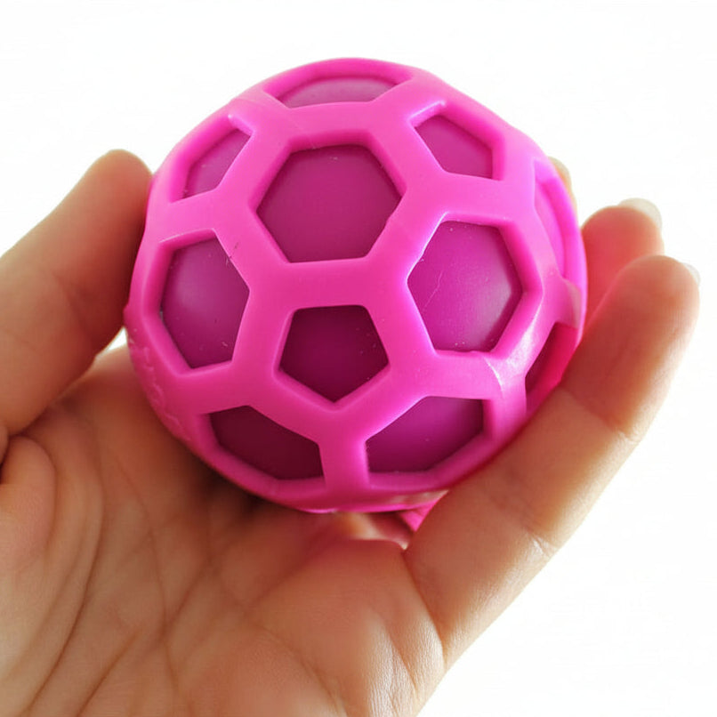 Pink geometric ball held in a hand with 'Curious Minds' branding.