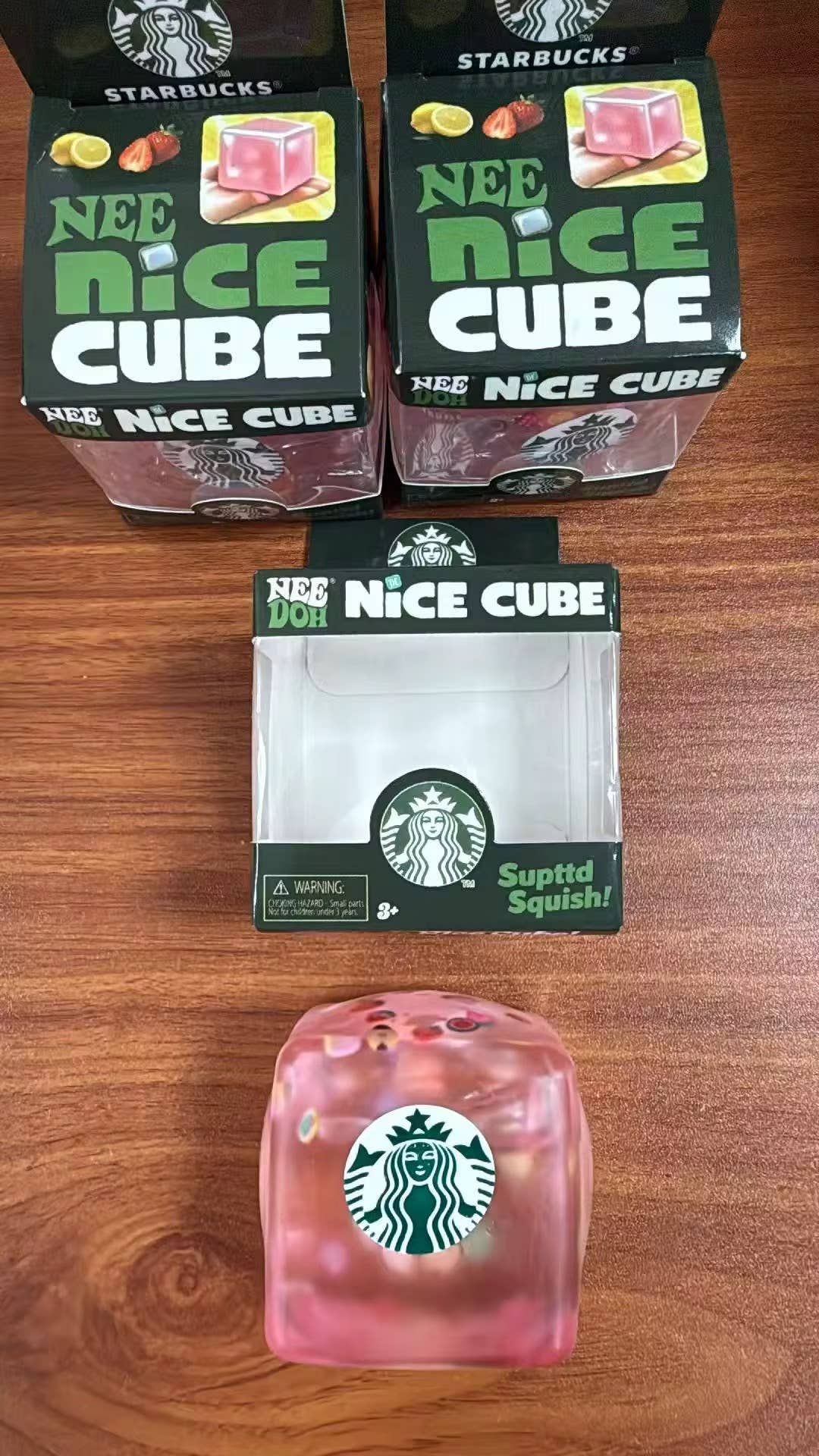 Starbucks Nice Cube packaging on a wooden surface