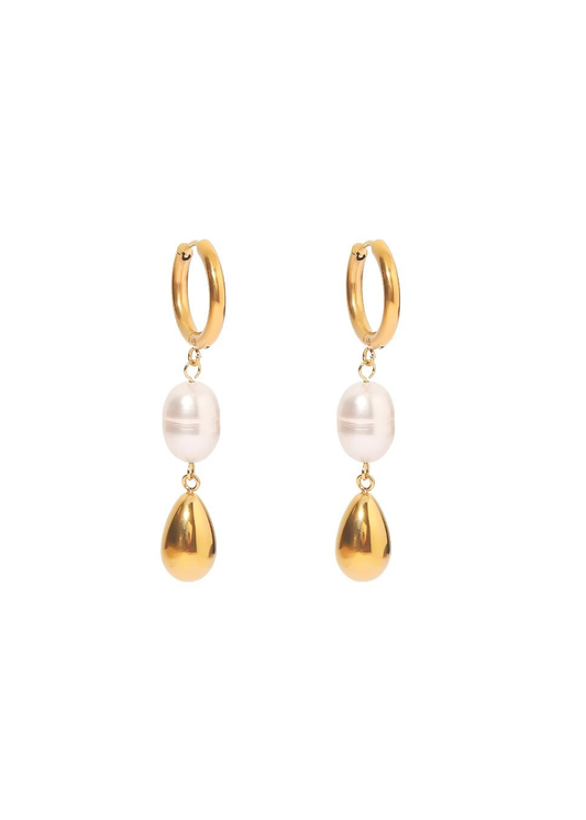 Pair of gold hoop earrings with pearl and gold teardrop charms on a white background