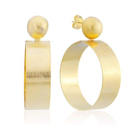 Gold hoop earrings with spherical elements on a white background