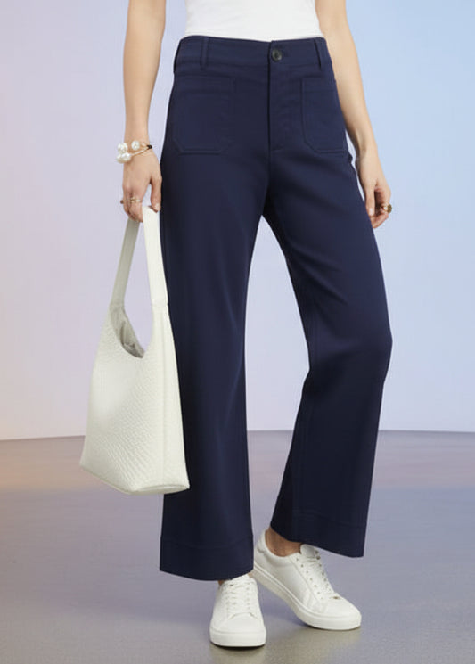 Navy pants worn by a person on a white background