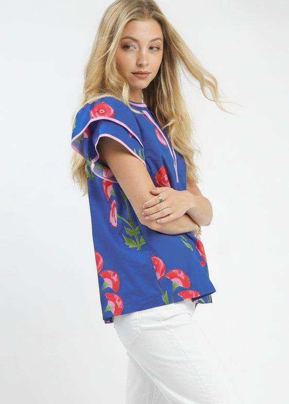 Woman wearing a blue floral blouse on a white background