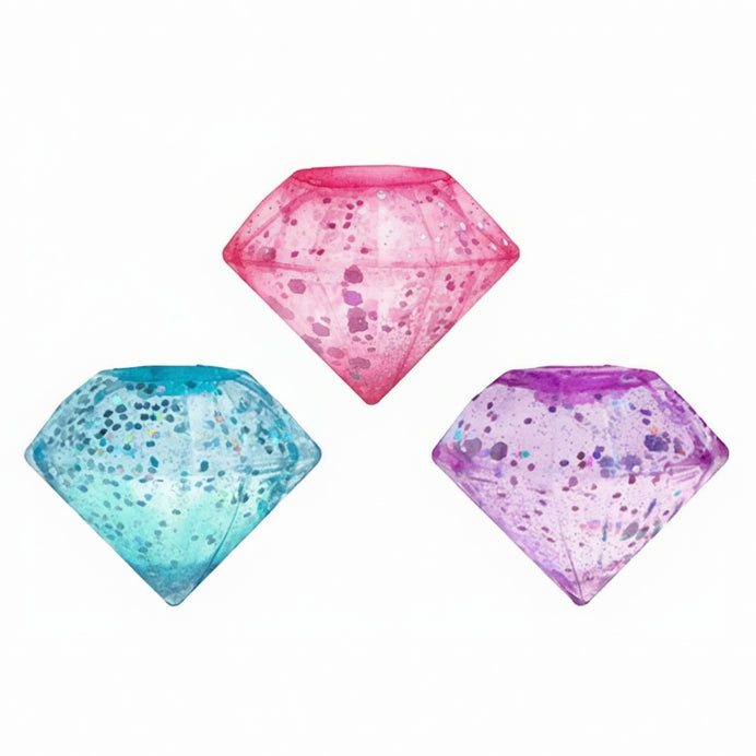 Three diamond-shaped toys in pink, blue, and purple on a white background with 'Curious Minds' branding.
