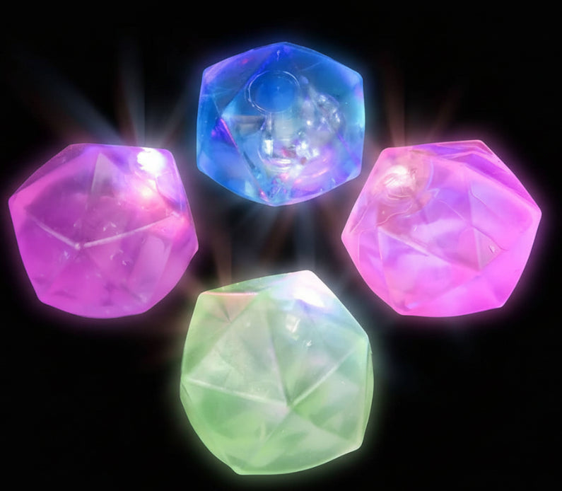 Four colorful LED dice with 'Curious' branding on a black background
