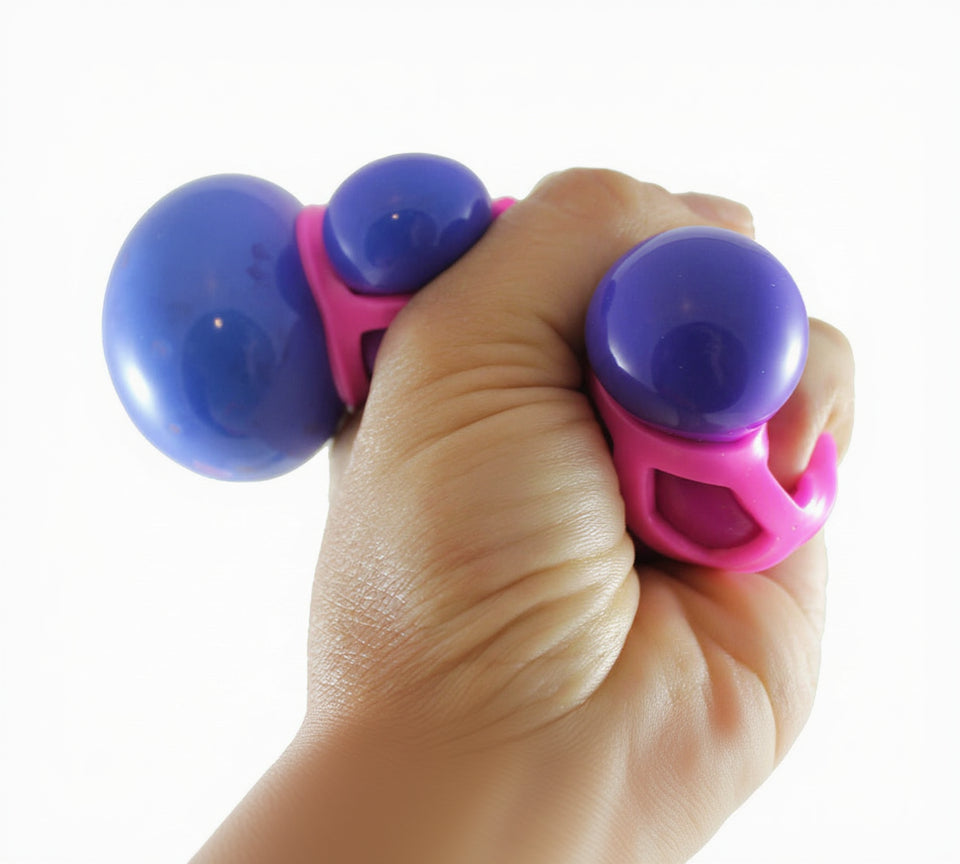 Hand holding a pink and purple fidget toy with 'Curious Minds' branding.