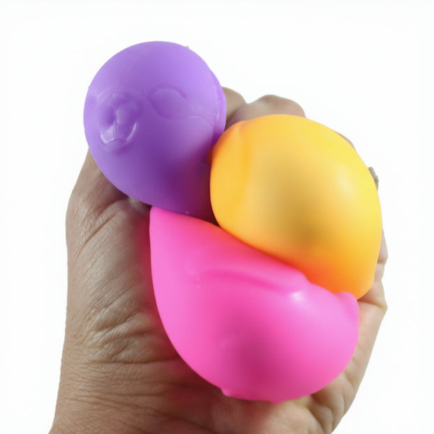 Colorful stress balls held in a hand with 'Curious Minds' branding.