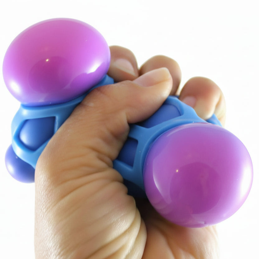Hand holding a blue and purple fidget toy with 'Curious Minds Busy Bags' branding.