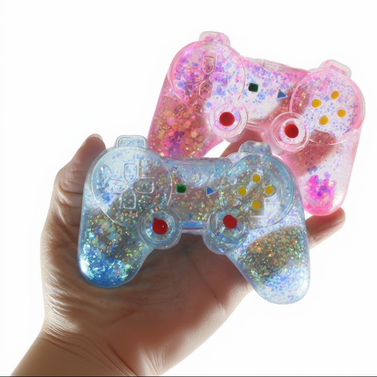 Two glittery toy controllers held in a hand with 'Curious Minds Busy Bags' branding.