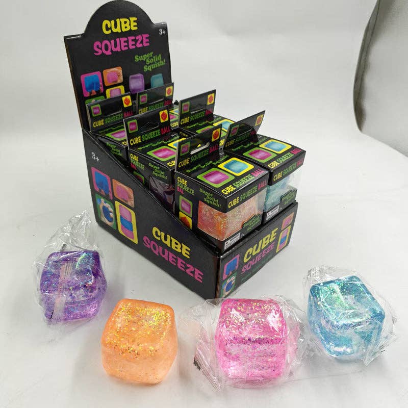 Display of Cube Squeeze products with colorful cubes on a white background