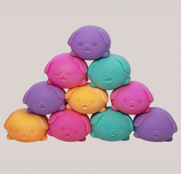 Colorful toy figures stacked in a pyramid shape with 'Curious Minds Busy Bags' branding.