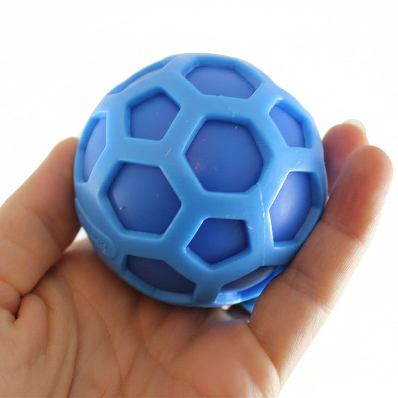 Blue geometric ball held in a hand with 'Curious Minds Busy Bags' branding.