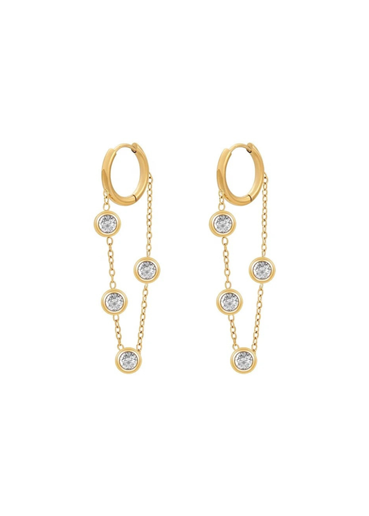 Gold hoop earrings with chain and gemstone details on a white background