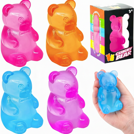 Colorful gummy bear toys with a hand holding a blue one, and packaging in the background.