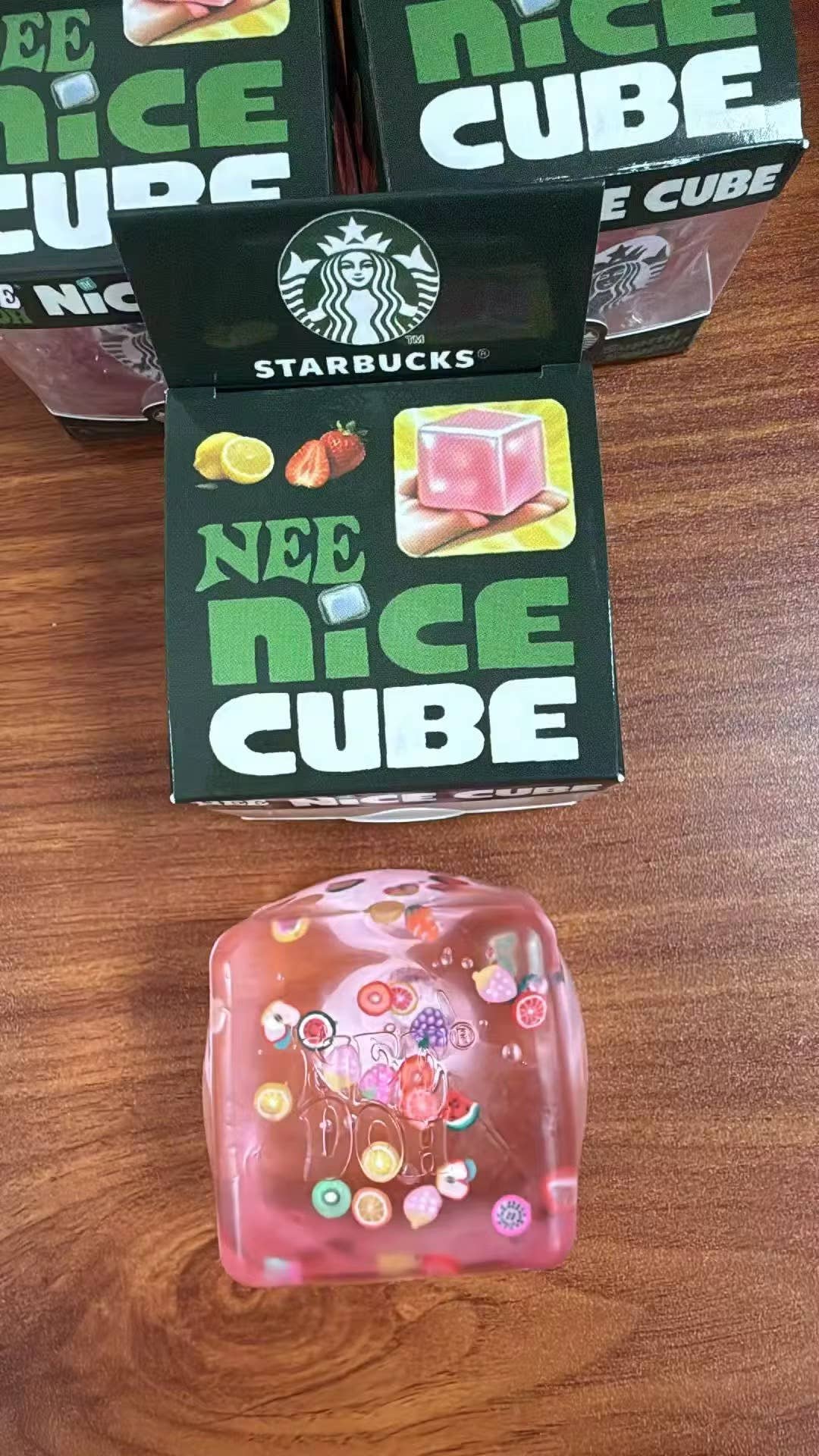 Starbucks NEE NICE CUBE packaging on a wooden surface