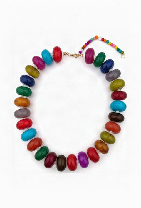 A beaded necklace made of colorful, glossy, oval-shaped beads in a rainbow of colors, arranged in a circle on a plain white background.