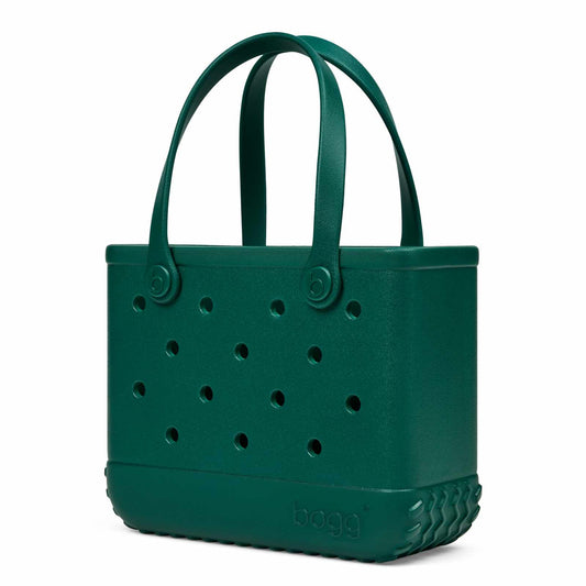 A dark Forest green Bogg bag with integrated handles, ventilation holes on the front, and a textured base, shown on a plain white background.