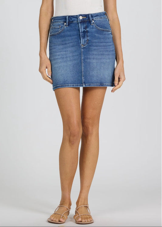 Person wearing a blue denim skirt on a white background