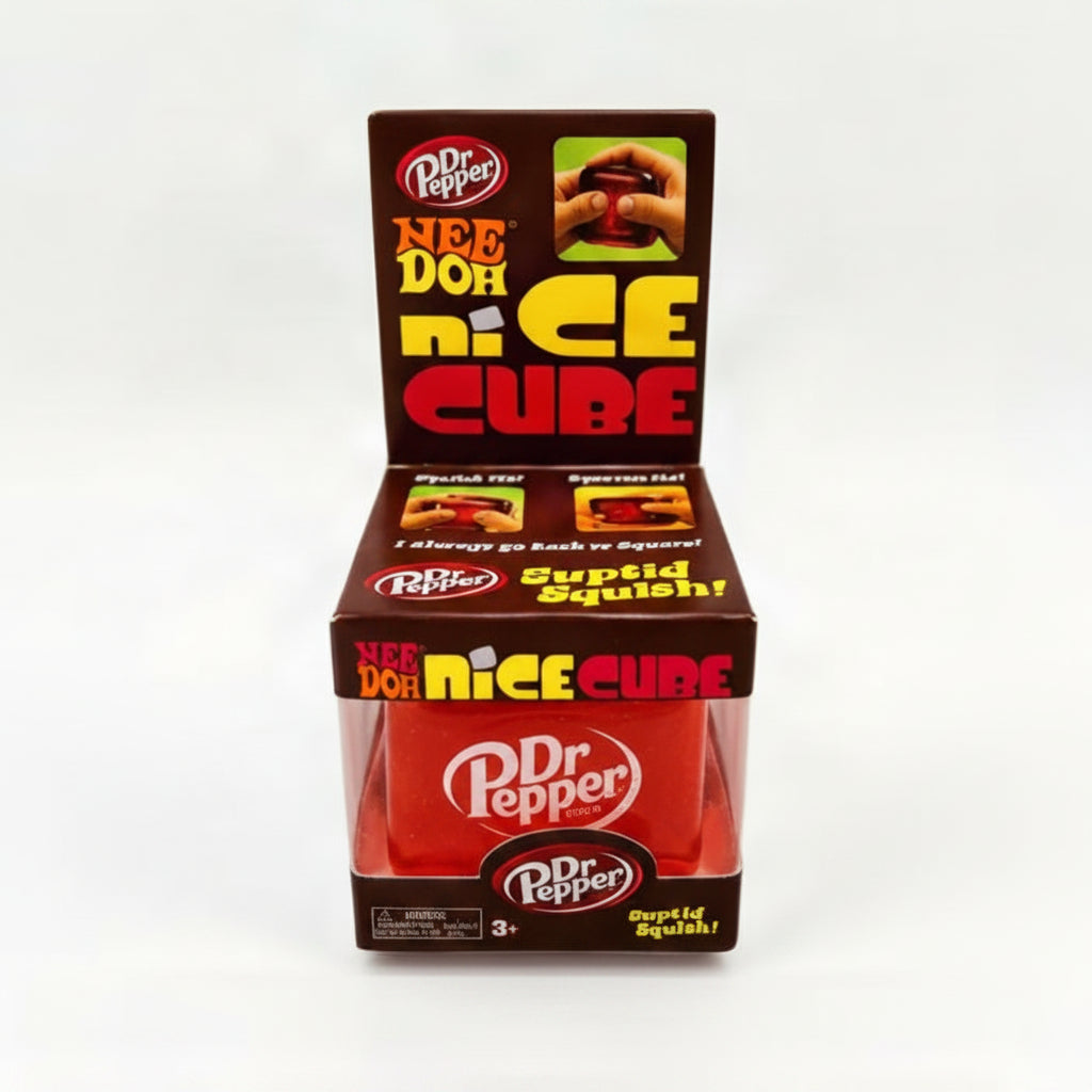 Dr Pepper Nee Doh Nice Cube Suptid Squish! novelty toy in its retail packaging, featuring a red cube inside a clear plastic container with a brown cardboard display box.
