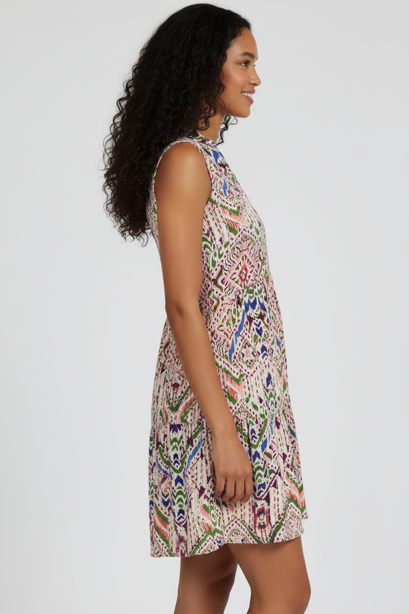 Woman wearing a patterned dress on a white background