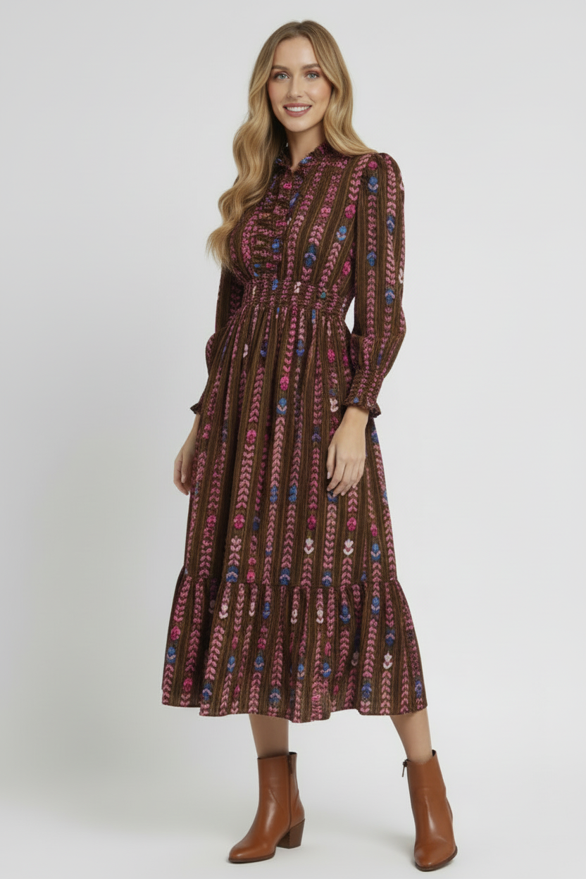 Woman wearing a patterned dress on a white background