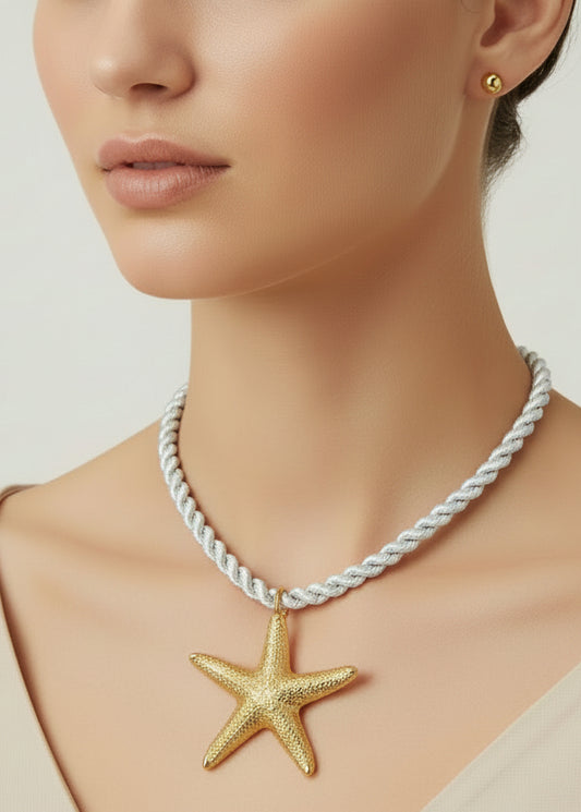 Necklace with a gold starfish pendant on a white background