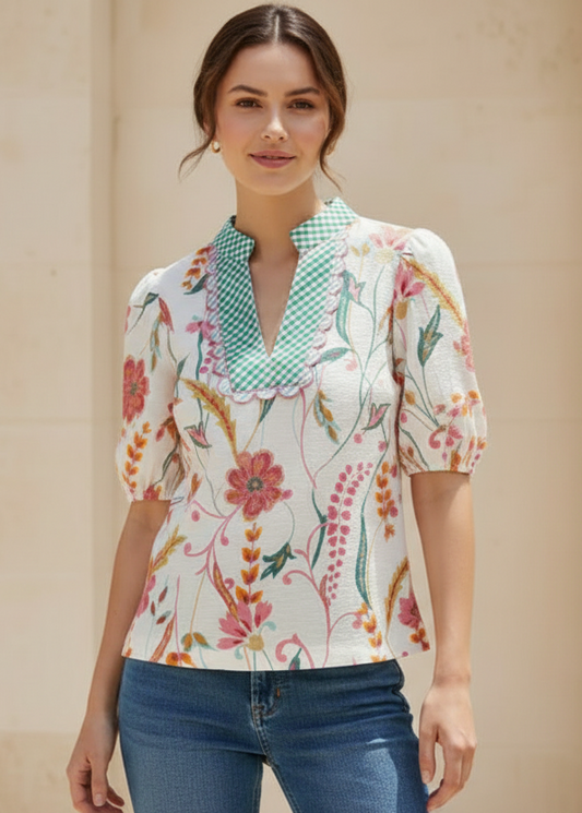 Woman wearing a floral blouse with a beige background