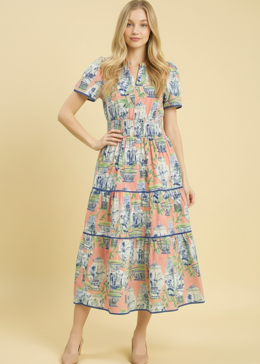 Woman wearing a patterned dress on a beige background