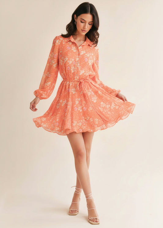 Woman wearing a coral floral dress on a beige background