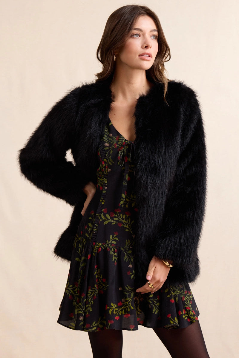 Luxurious faux fur coat that brings timeless elegance to any wardrobe. The Mathilde features plush, soft fur with a rich texture that captures the sophistication of genuine fur without compromise. Perfect for layering over dresses or pairing with casual pieces for an instant uplift in style. The classic silhouette can be dressed up for evening events or down for weekend sophistication. Versatile enough to complement both polished and relaxed looks.