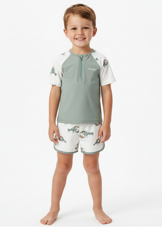 Children's swim set with green and white design on a white background