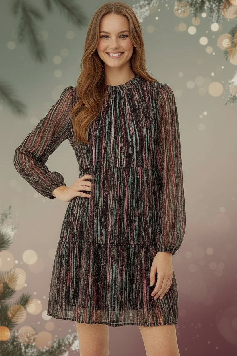 Woman wearing a patterned dress on a white background
