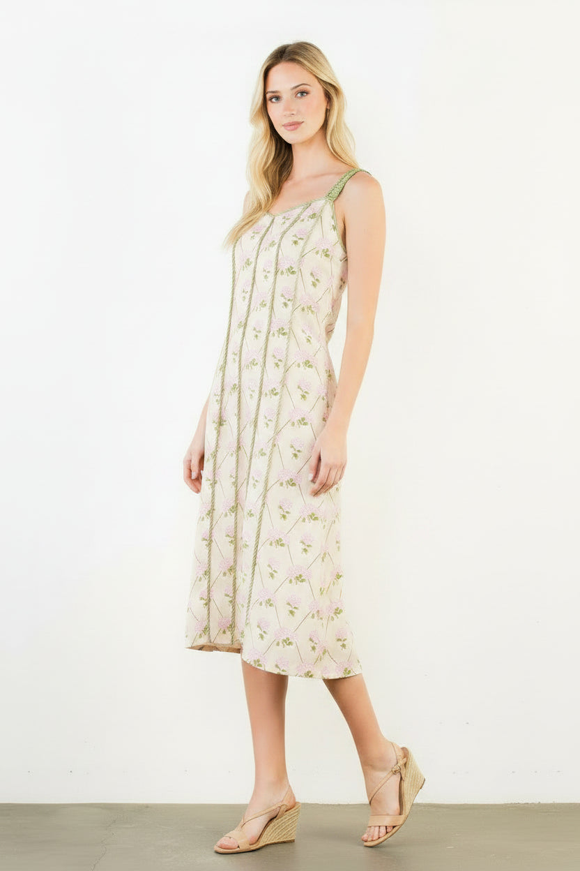 Woman wearing a floral dress against a white background
