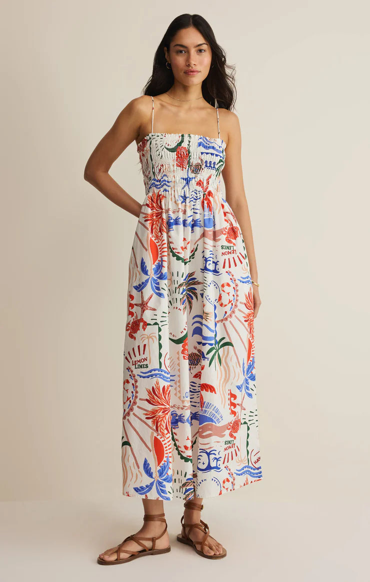 Woman wearing a colorful floral dress on a beige background