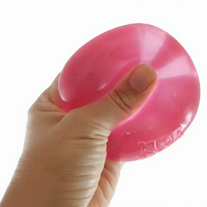 Hand holding a pink stress ball with 'Curious Minds' logo in the corner