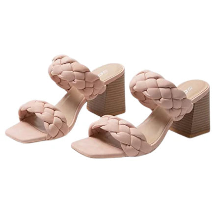 Pair of pink woven high-heeled sandals on a white background